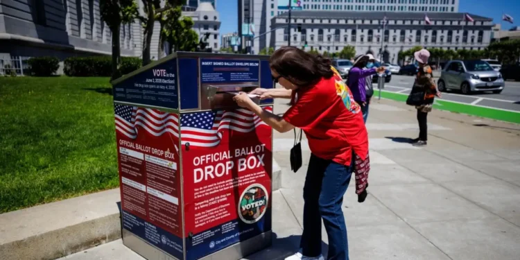 Voter deposits a ballot into an official San Francisco drop box, illustrating the California ballot ruling dispute.
