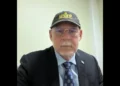 Allen Chastanet wearing a black United Workers Party cap, central to the debate over Chastanet's Political Masterstroke.