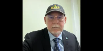 Allen Chastanet wearing a black United Workers Party cap, central to the debate over Chastanet's Political Masterstroke.