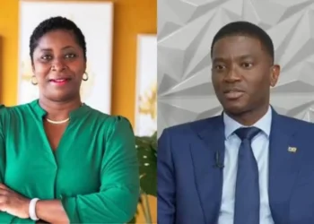 Portraits of Grenada election party leaders Emmalin Pierre, left, in a green blouse with her arms crossed, and Prime Minister Dickon Mitchell, right, in a blue suit speaking.